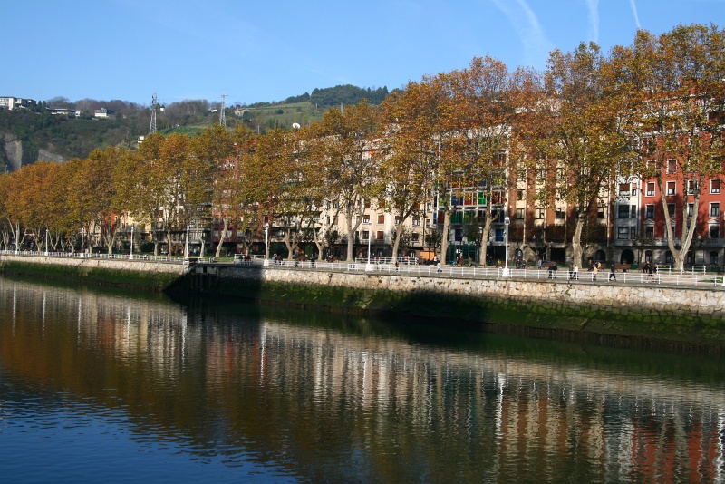 IMG_6305.JPG - View along the river Nervin in Bilbao.  The building with the multi-colored windows was our hotel.