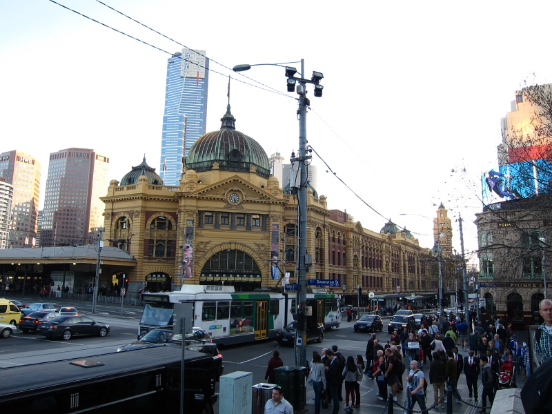 IMG_3281.JPG - Flinders Street Station - the first railway station in Australia and one of the world's busiest in the 1920s.  Trains have been running here since 1854, when the site was called Melbourne Terminus.  The soaring 300m-tall skyscraper in the back is the Eureka Tower, named after the Eureka Stockade rebellion during the 1854 gold rush (the red stripe depicts the blood shed during the revolution).