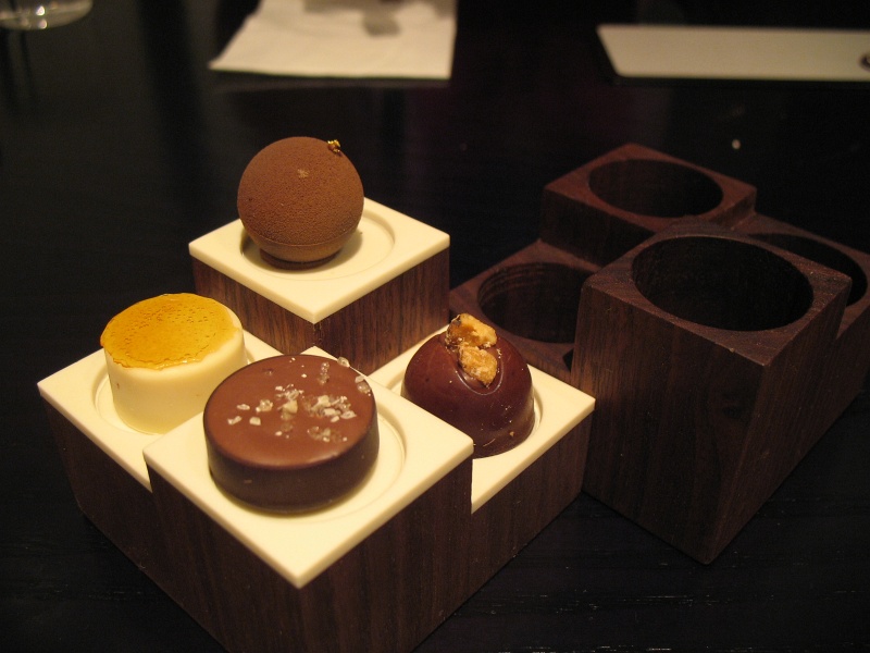 IMG_5218.JPG - Petit fours: maple, walnut, sesame, crme de caroline (clockwise from top)