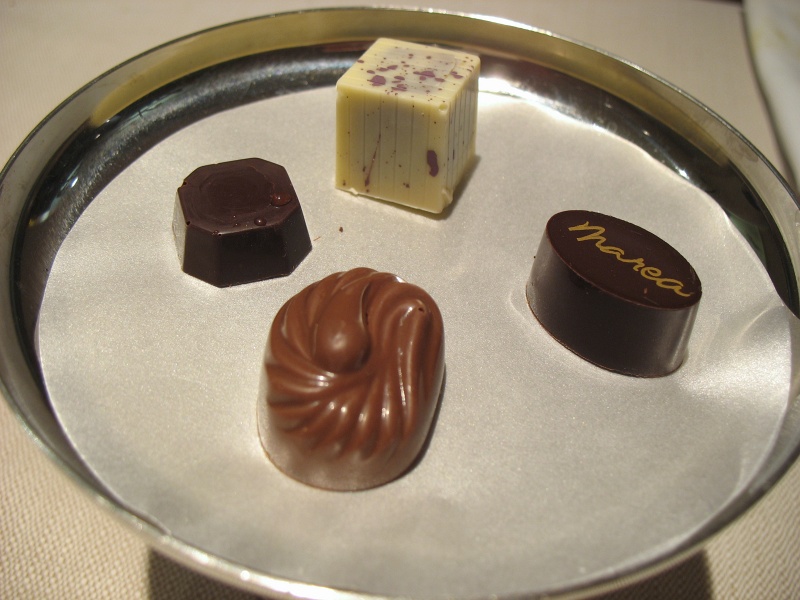 IMG_5033.JPG - Petit fours chocolates: (clockwise from top) white chocolate lavender, caramel, peanut butter, mint