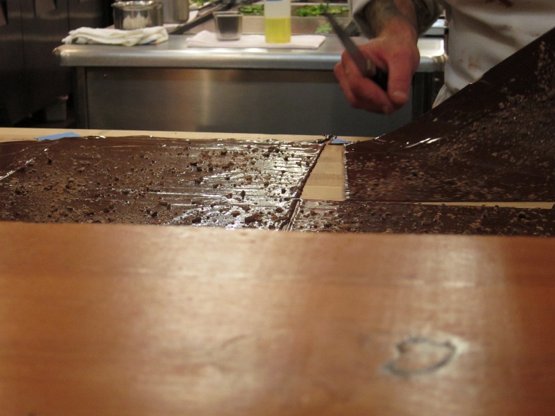 IMG_0443.JPG - Making sheets of cacao nibs-covered chocolate on wax paper