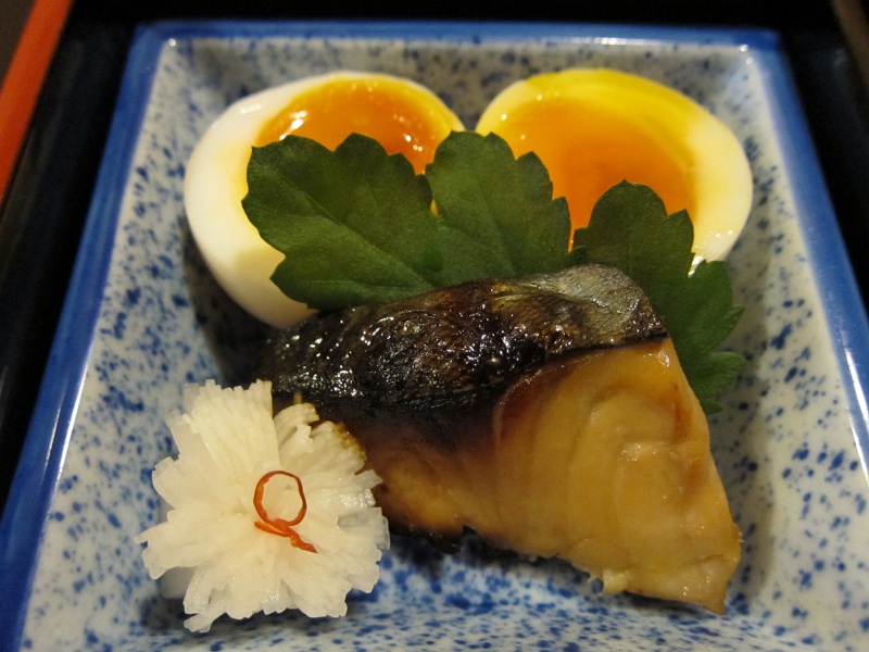 IMG_0229.JPG - First up, grilled mackerel, a daikon radish carved like a flower with a sliver of pepper, and a soft-boiled egg
