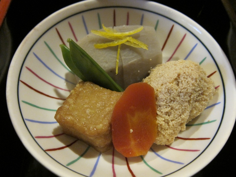 IMG_0231.JPG - Clockwise from top: two sugar pea sprouts, taro with yuzu slivers that look like a dragonfly, a clump of cooked fish roe (tobiko?), carrot, and fried mochi