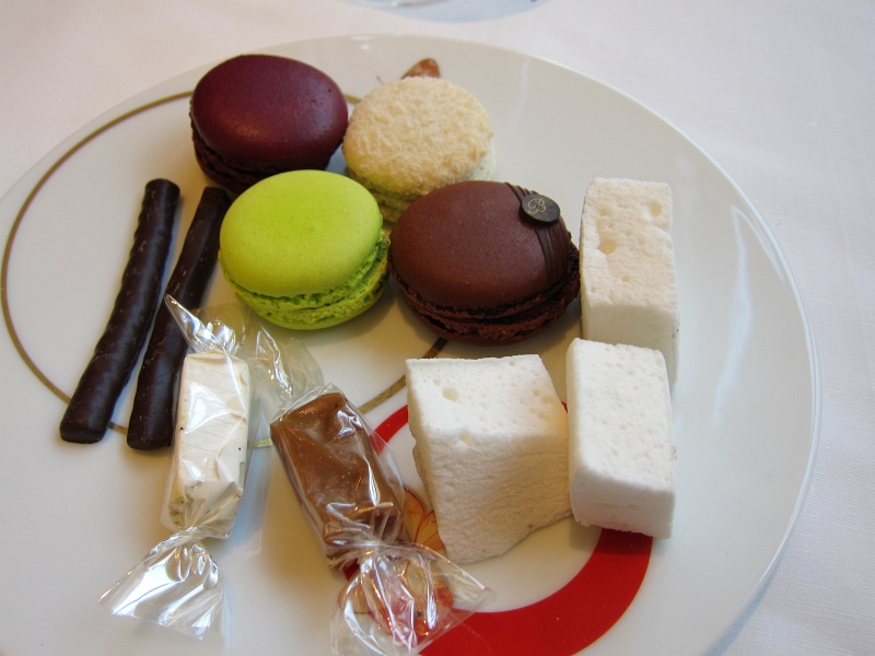 IMG_1445.JPG - Macarons: blueberry-violet, pistachio-lime, coconut-banana, coffee, plus nougat, chocolate orange sticks, really strong mint marshmallows