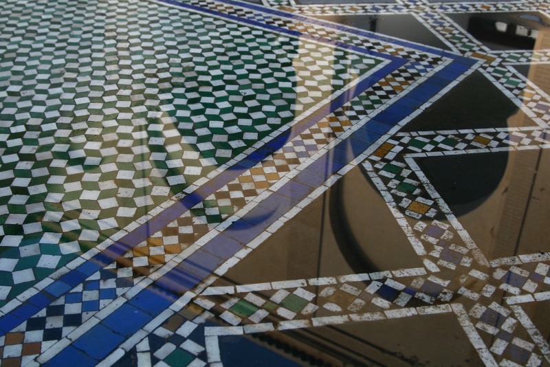 IMG_7974.JPG - Intricate mosaic floors in the courtyard reflecting the sky, after the previous day's rains