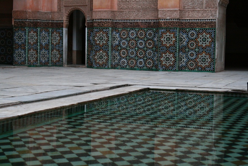 IMG_8372.JPG - Detail of the shallow reflecting pool.  The Ben Youssef Medersa was expanded to its present size by Saadian sultan in 1564 to try to compete with Fes as the intellectual capital of Morocco.