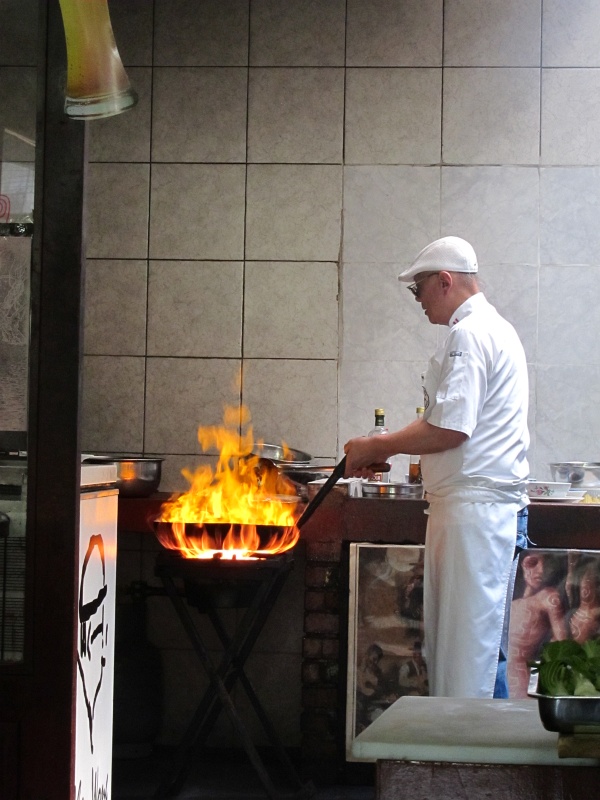 IMG_1724.JPG - Javier Wong, the chef of Chez Wong, making flounder stir fry on a custom gas-fired wok.   Watch him cook .