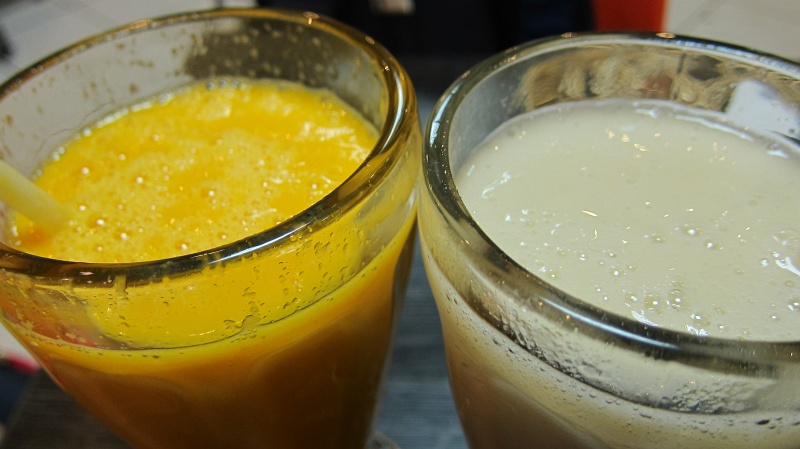 IMG_1773.JPG - To adjust to the altitude in Cusco on the first day, we sampled fresh juices.  The yellow one is lucuma (a yellow fruit that tastes like maple and sweet potato) and white is custard apple.