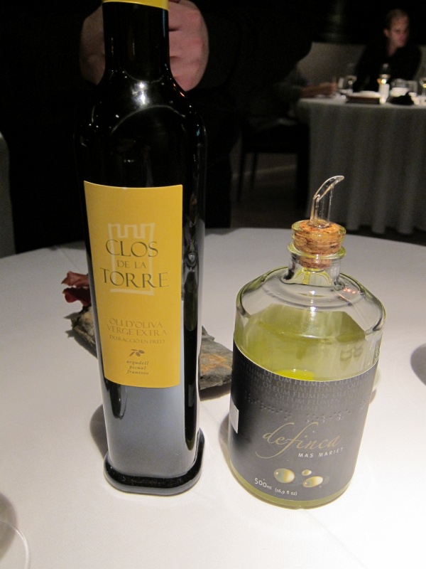 IMG_0150.JPG - Two olive oils to accompany the bread.  Clos de la Torre (left) is a blend of argudell, picual, and frantoio olives, deFinca (right) is made from arbequina and gordal olives from a single estate in Mas Mariet in Les Garrigues.