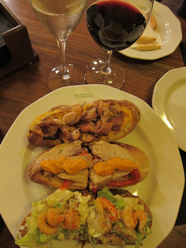 IMG_2704.JPG - Two glasses of wine, three montaditos (mounted sandwich) - grilled quail breast, tuna, and langoustine, at Taberna Tempranillo in Madrid.  This meal was only €18.