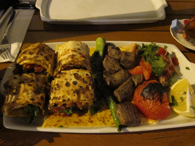 IMG_0623.JPG - Dinner at Antiochia.  Durum (left): minced meat kebabs and chopped onions/tomatoes wrapped in flatbread with spicy pepper paste, then grilled over coal.  Sis kebab (right): grilled pieces of tender beef.